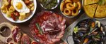 tapas-espanolas-una-mesa-con-comida-tipica-espanola-vista-desde-arriba-1-1116x473.jpg